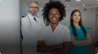 Stock photograph of three healthcare professionals in a clinical setting.